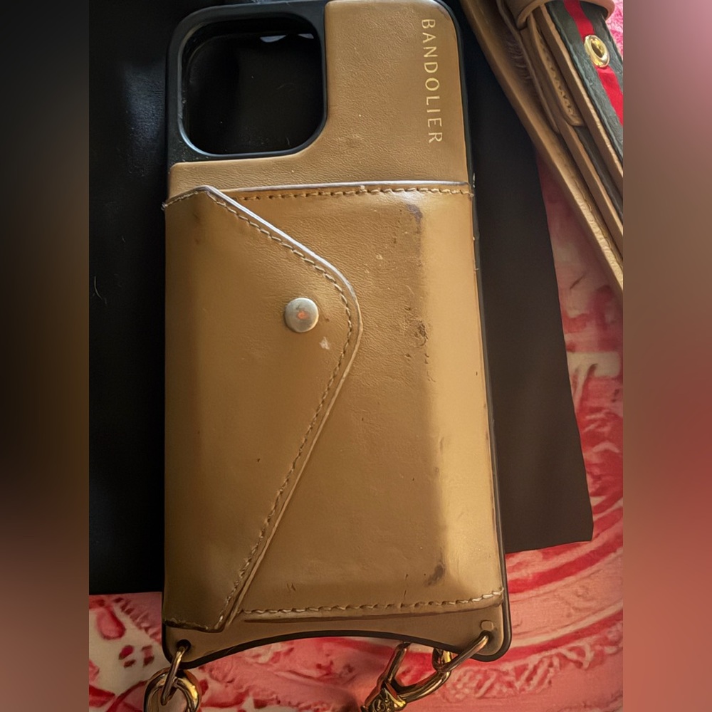 Bandolier 13 pro max phone case with strap.